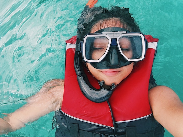 female with swimming mask gear