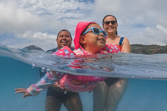 family of 3 swimming