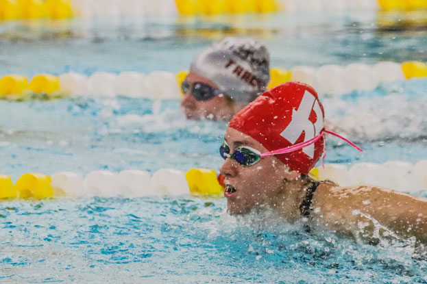 Maintain streamlined body position in swimming